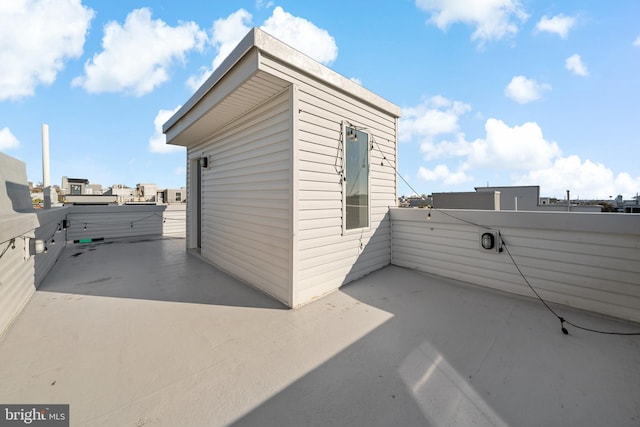 view of side of property featuring a patio