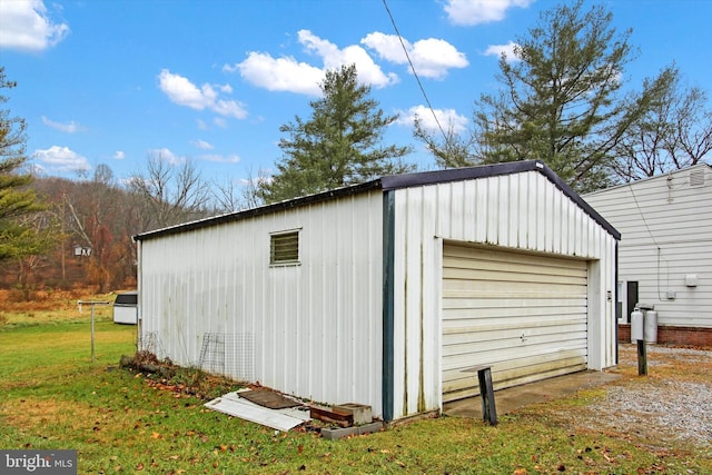 garage featuring a yard