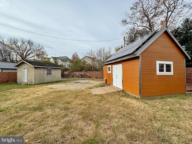 view of yard featuring a patio and an outdoor structure