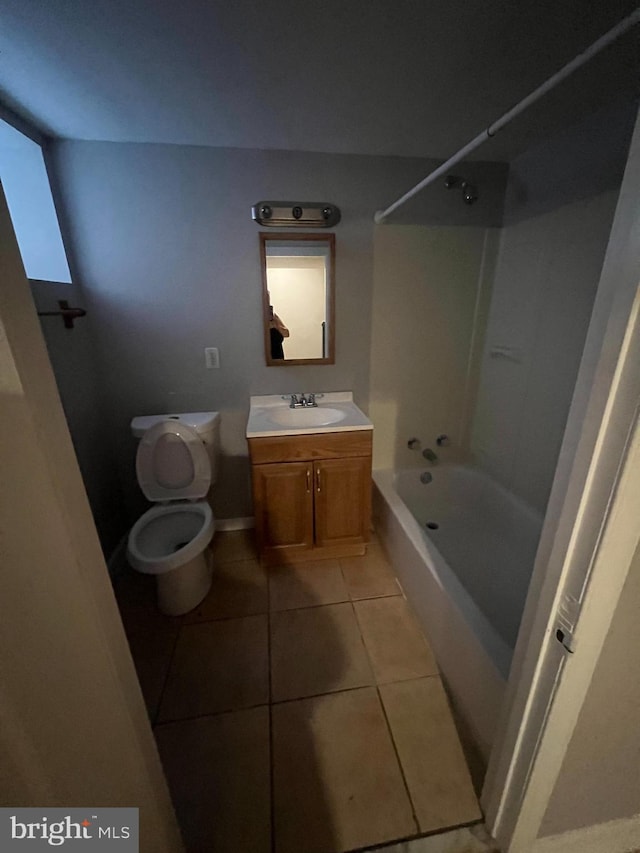 full bathroom with tile patterned flooring, bathtub / shower combination, vanity, and toilet