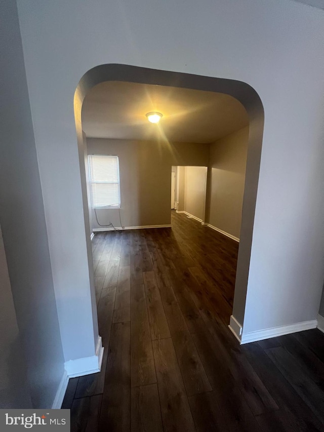 hallway featuring dark hardwood / wood-style floors