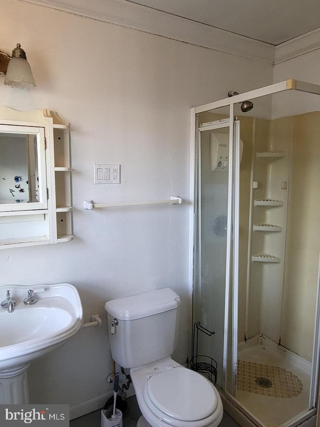 bathroom featuring toilet and walk in shower