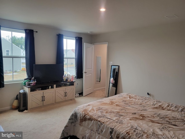 bedroom with light colored carpet