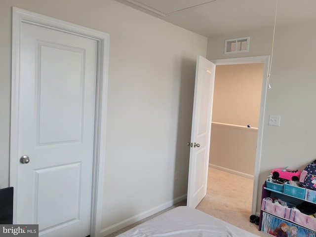 bedroom with light colored carpet