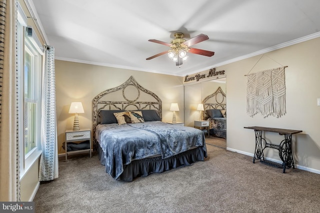 carpeted bedroom featuring ceiling fan and crown molding