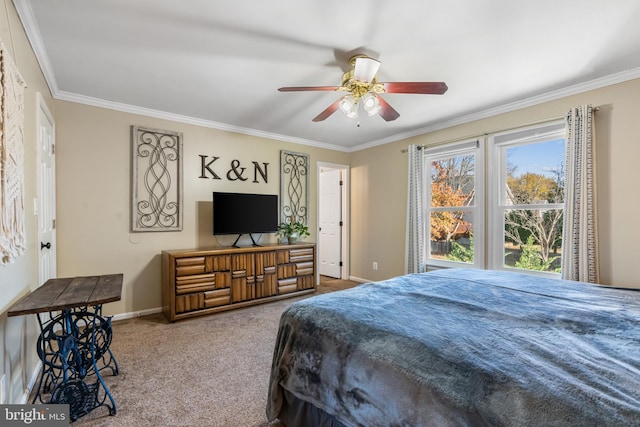 carpeted bedroom with ceiling fan and ornamental molding