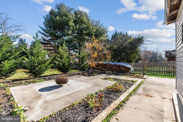 view of yard featuring a patio area and a fire pit