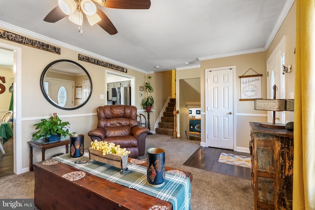 living room with carpet flooring, ceiling fan, and ornamental molding