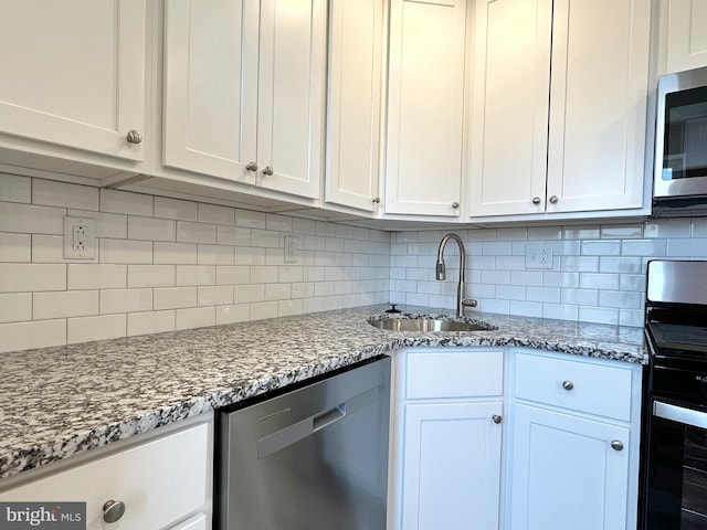 kitchen with white cabinets, sink, and stainless steel appliances