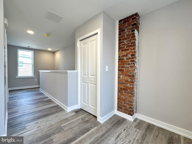 hallway featuring wood-type flooring