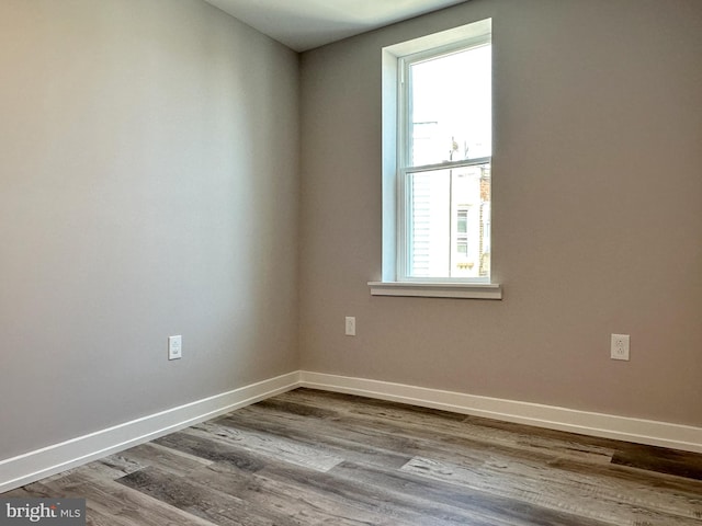 unfurnished room featuring wood-type flooring