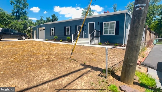 ranch-style house featuring a garage