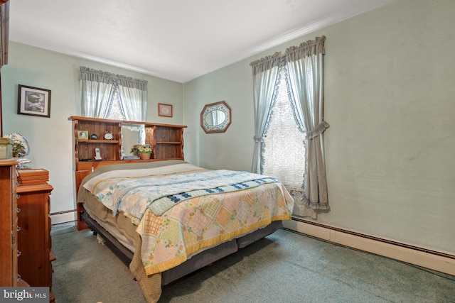 carpeted bedroom with a baseboard radiator