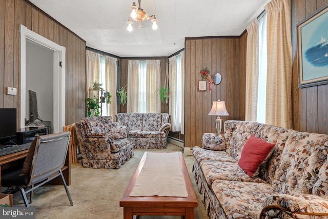 living room with wooden walls, a healthy amount of sunlight, and ornamental molding