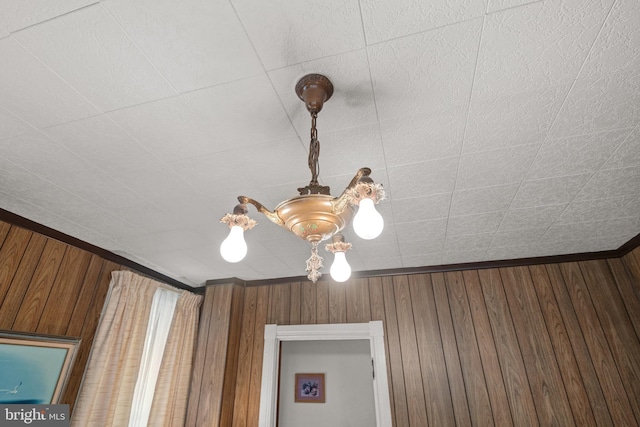 details with wood walls and ornamental molding