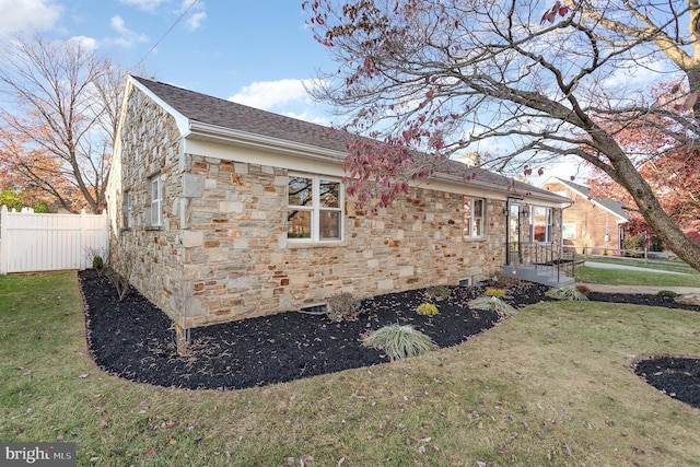 view of home's exterior with a lawn