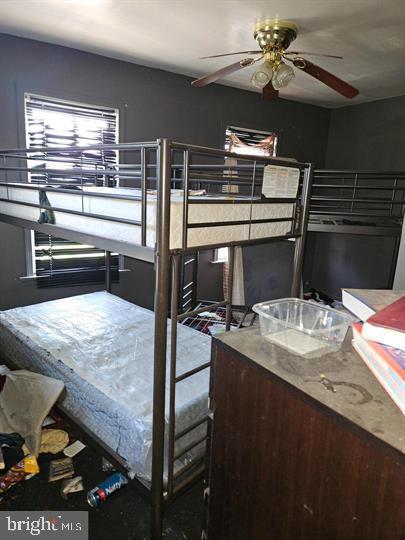 bedroom featuring ceiling fan