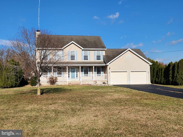 view of front of house with a front lawn, a porch, and a garage