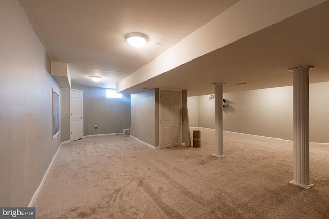 basement featuring light colored carpet