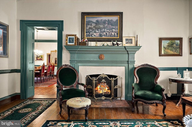 sitting room featuring wood-type flooring