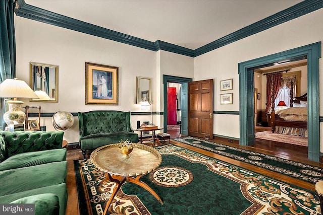 living room featuring hardwood / wood-style floors and ornamental molding