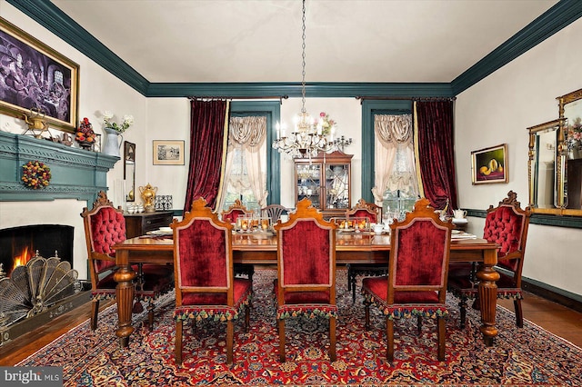 dining room featuring hardwood / wood-style flooring, a notable chandelier, and ornamental molding