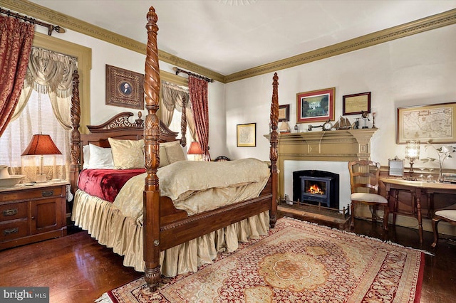 bedroom featuring dark hardwood / wood-style flooring and crown molding