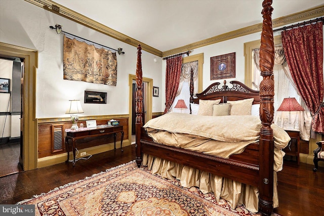 bedroom featuring dark hardwood / wood-style flooring and crown molding