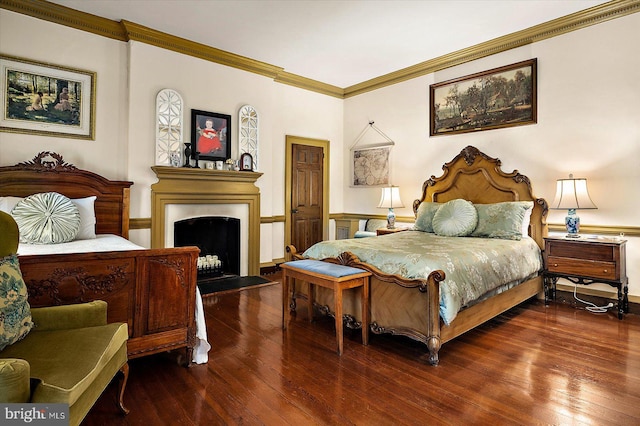 bedroom featuring wood-type flooring and crown molding