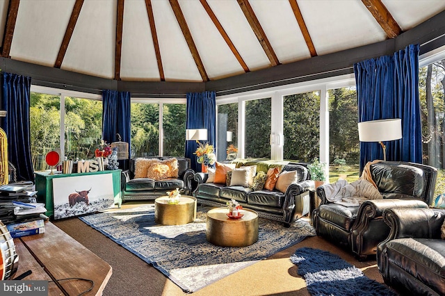 sunroom / solarium with lofted ceiling with beams