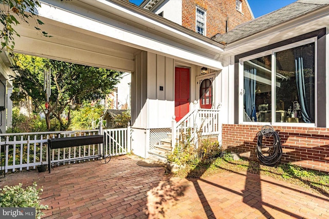 entrance to property featuring a patio area