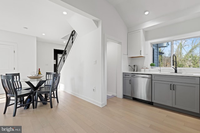 dining space featuring sink and light wood-type flooring