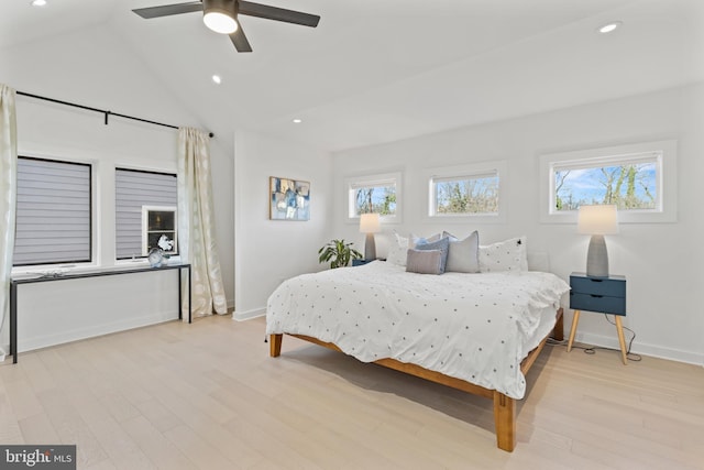 bedroom featuring vaulted ceiling, ceiling fan, and light wood-type flooring