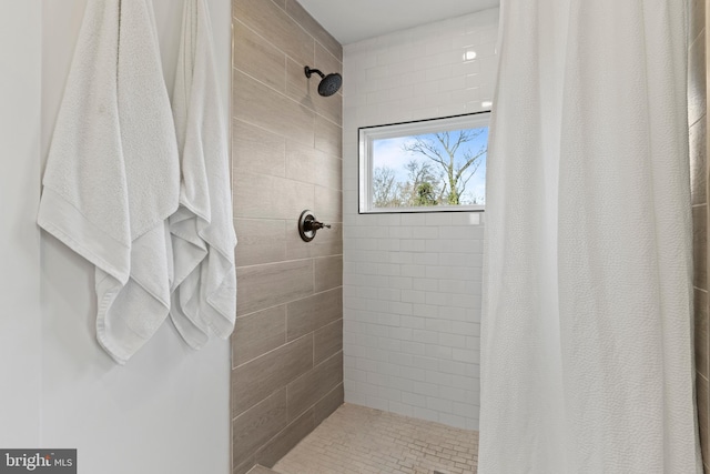 bathroom with a shower with curtain