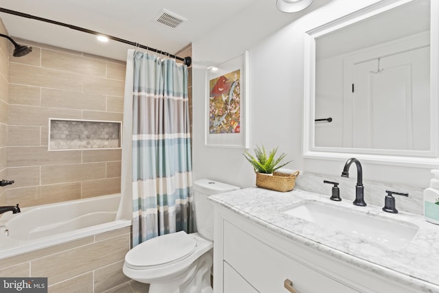 full bathroom with vanity, shower / tub combo with curtain, and toilet