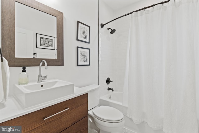 full bathroom with vanity, shower / tub combo, and toilet