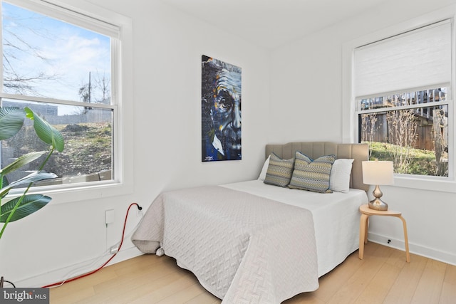 bedroom featuring wood-type flooring