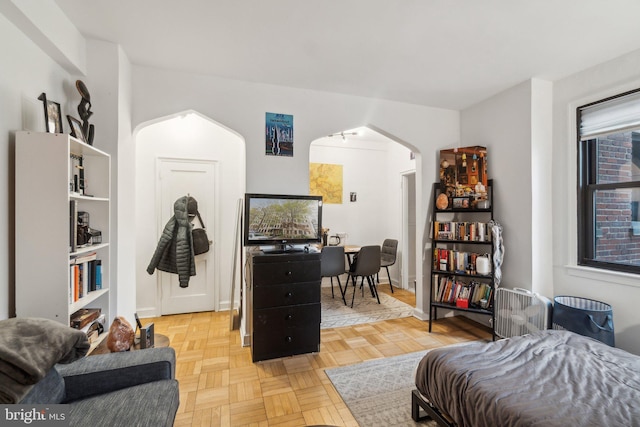 office area featuring parquet flooring