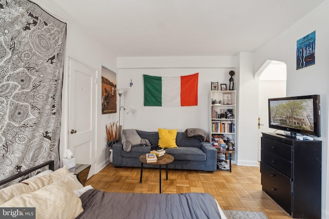 living room featuring parquet floors