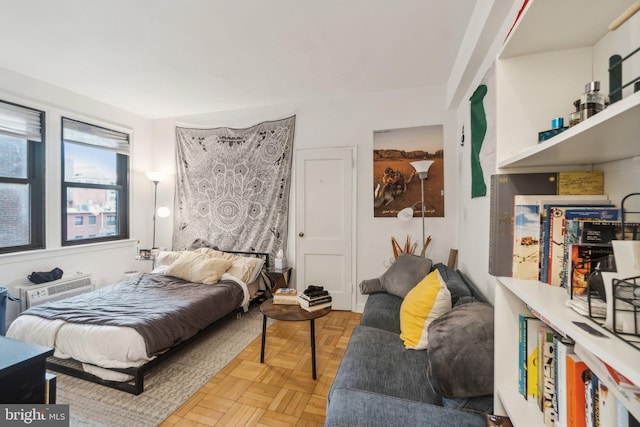 bedroom featuring light parquet floors