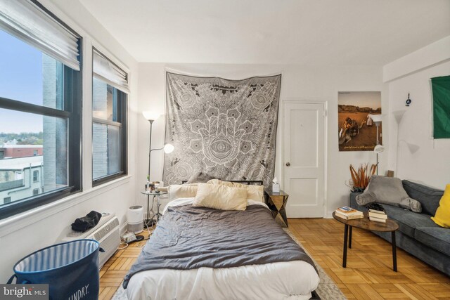 bedroom featuring light parquet floors