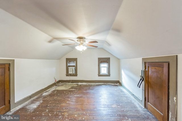 bonus room with hardwood / wood-style floors, vaulted ceiling, and ceiling fan