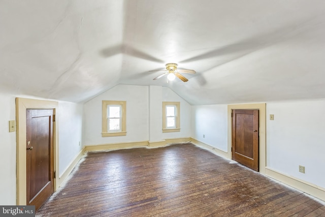 additional living space featuring ceiling fan, dark hardwood / wood-style flooring, and vaulted ceiling