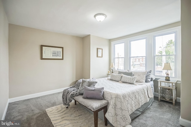 bedroom featuring dark carpet