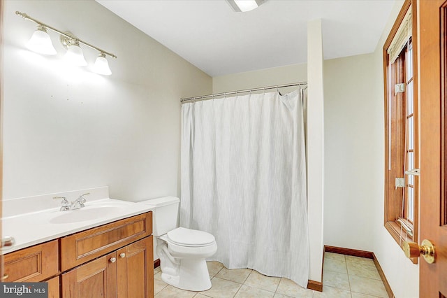 bathroom with tile patterned floors, vanity, toilet, and a shower with curtain