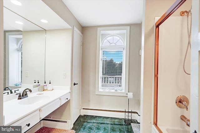 bathroom with tile patterned flooring, a baseboard heating unit, vanity, and tub / shower combination