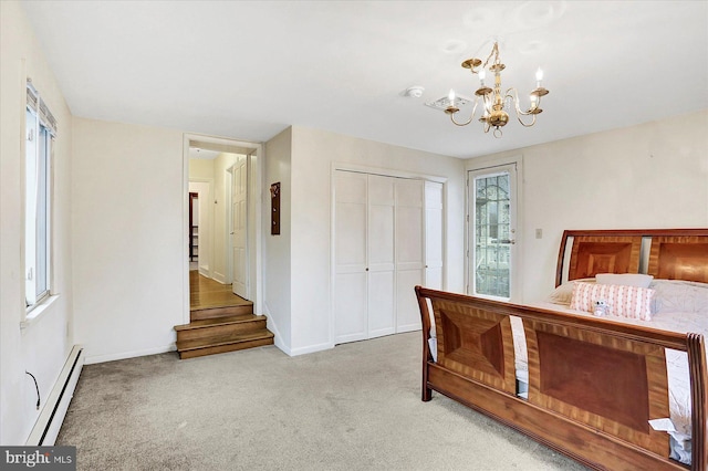 unfurnished bedroom featuring multiple windows, a closet, light colored carpet, and baseboard heating