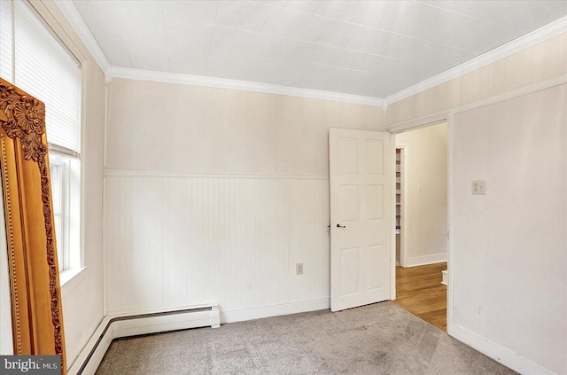 carpeted spare room featuring ornamental molding and a wealth of natural light