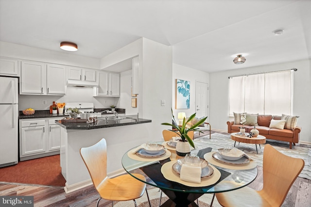 dining area featuring dark hardwood / wood-style floors