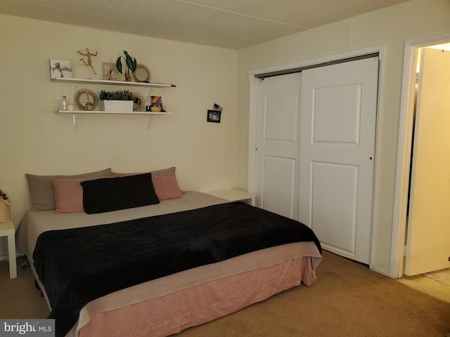 carpeted bedroom featuring a closet